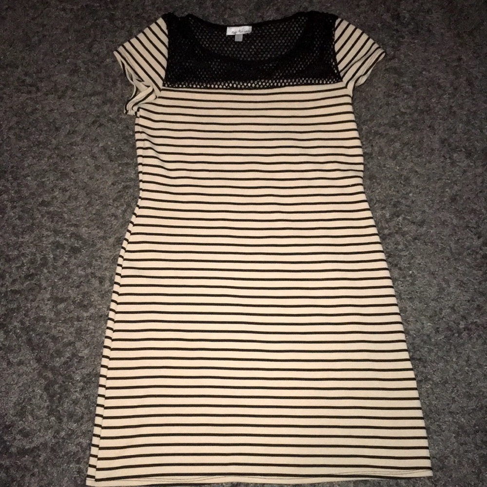 Very cute black and cream colored dress.